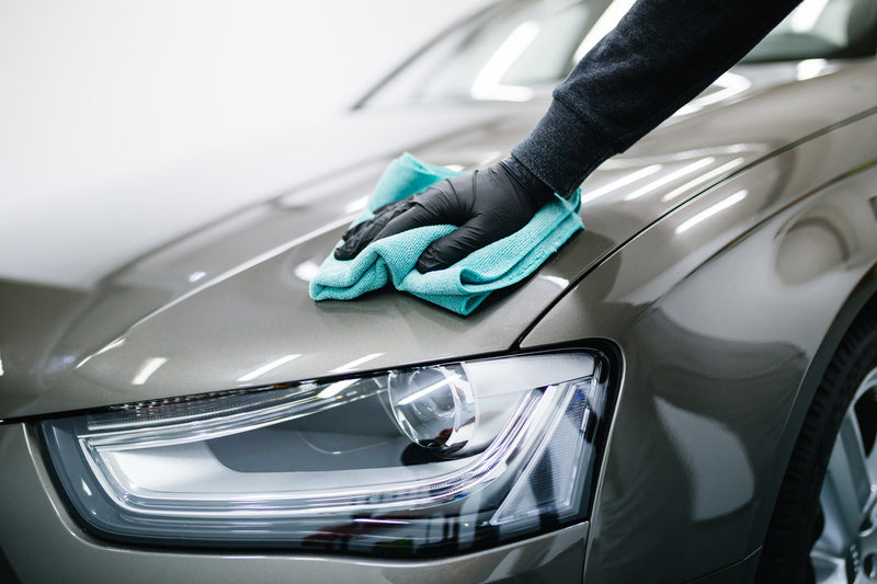Image wiping hood and detailing Audi car
